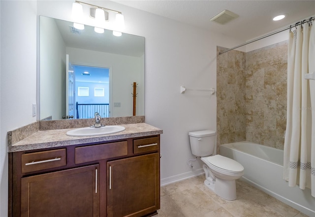 full bathroom featuring shower / bath combo with shower curtain, vanity, and toilet