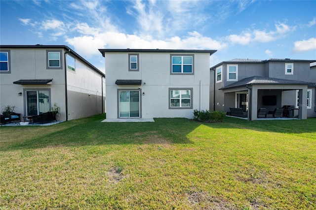 back of house with a yard