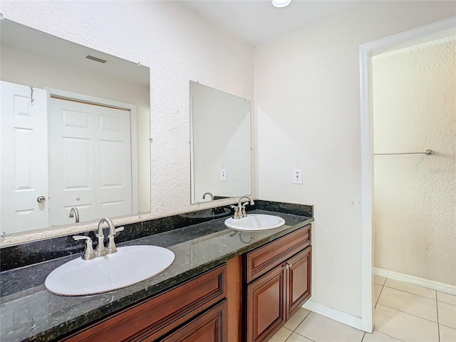 bathroom featuring tile patterned floors and vanity