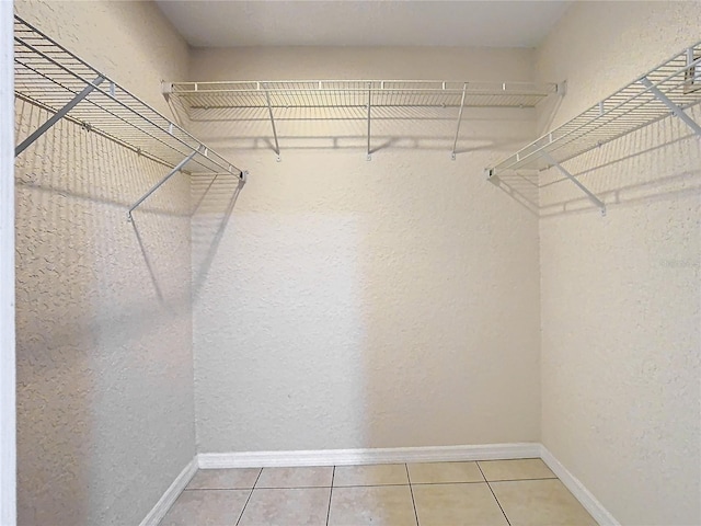 walk in closet featuring tile patterned floors