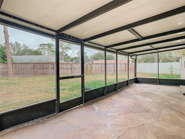 unfurnished sunroom with a wealth of natural light