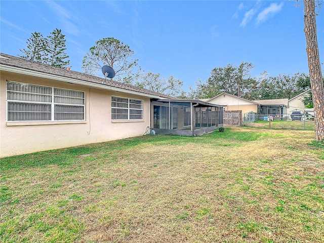 view of yard featuring a sunroom