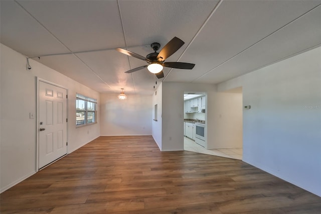 unfurnished room featuring ceiling fan and wood-type flooring