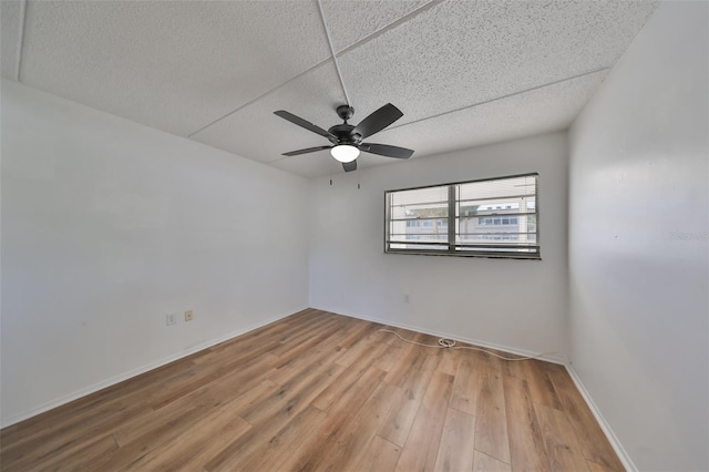 spare room featuring ceiling fan and light wood-type flooring