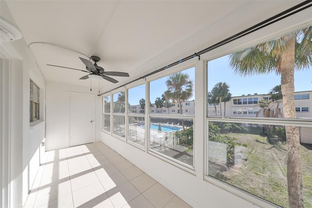 sunroom / solarium with ceiling fan