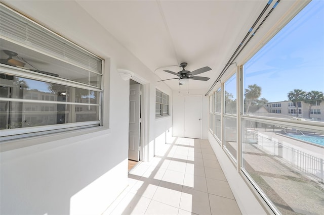 sunroom / solarium with ceiling fan