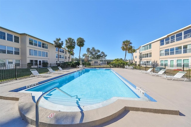 view of swimming pool with a patio