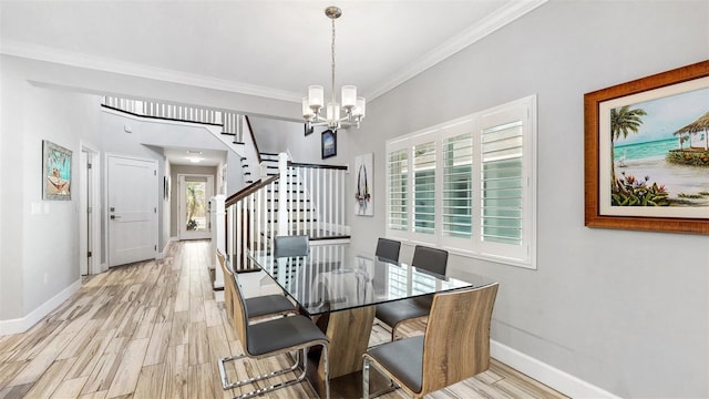 dining space with a notable chandelier, light wood-type flooring, and ornamental molding