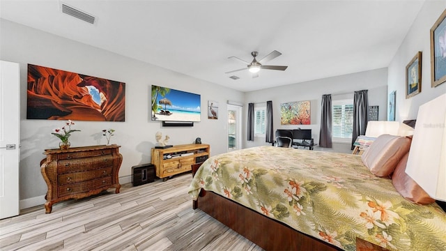 bedroom featuring ceiling fan and light hardwood / wood-style flooring