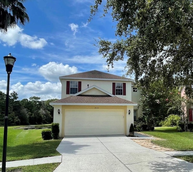 view of front of home featuring a garage and a front yard