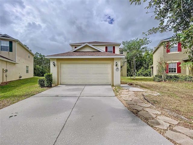 front facade featuring a garage and a front lawn