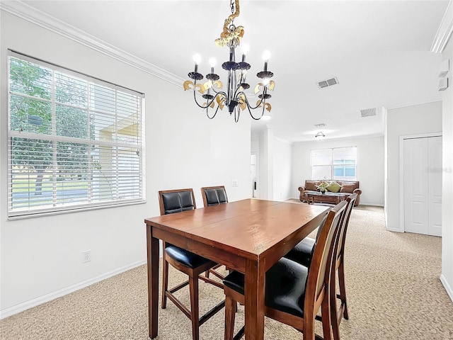 dining area with crown molding, a chandelier, and light carpet