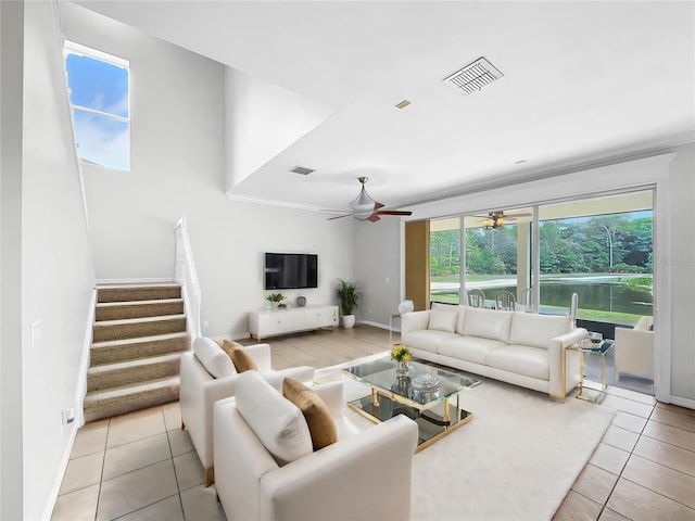 tiled living room with ceiling fan