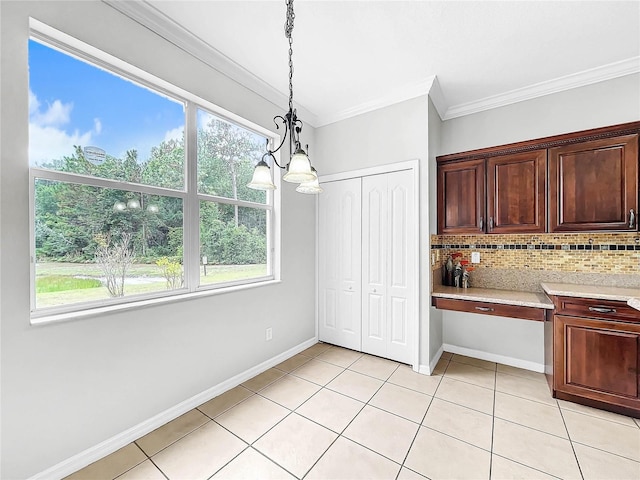 unfurnished dining area with light tile patterned floors, a chandelier, and ornamental molding