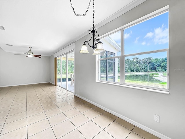 tiled spare room with a water view, ceiling fan with notable chandelier, and ornamental molding