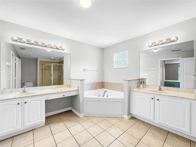 full bathroom with tile patterned flooring, vanity, toilet, and independent shower and bath