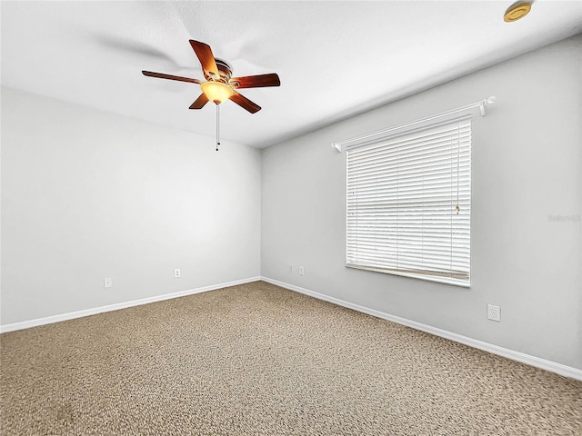 empty room featuring carpet and ceiling fan