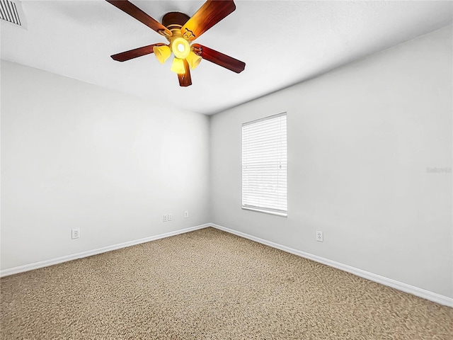 unfurnished room with carpet flooring and ceiling fan