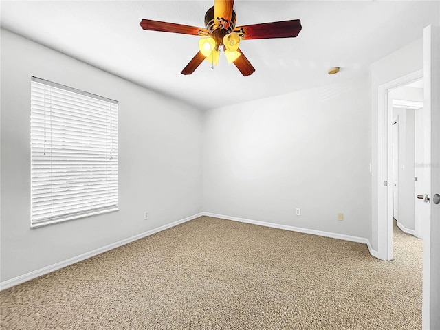 unfurnished room featuring carpet and ceiling fan