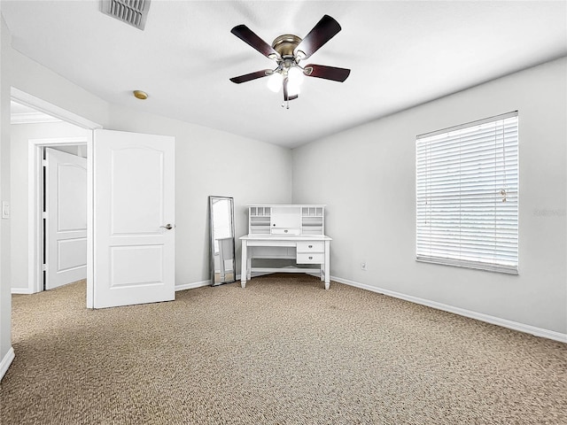 unfurnished bedroom featuring carpet and ceiling fan