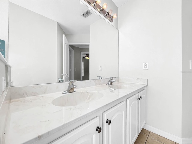 bathroom featuring tile patterned flooring and vanity