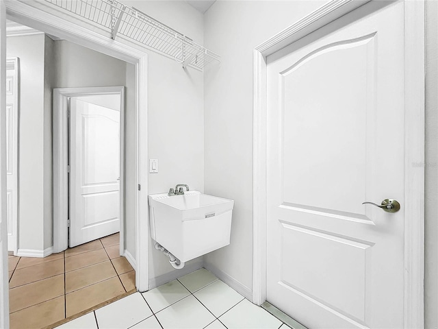 bathroom featuring tile patterned flooring and sink