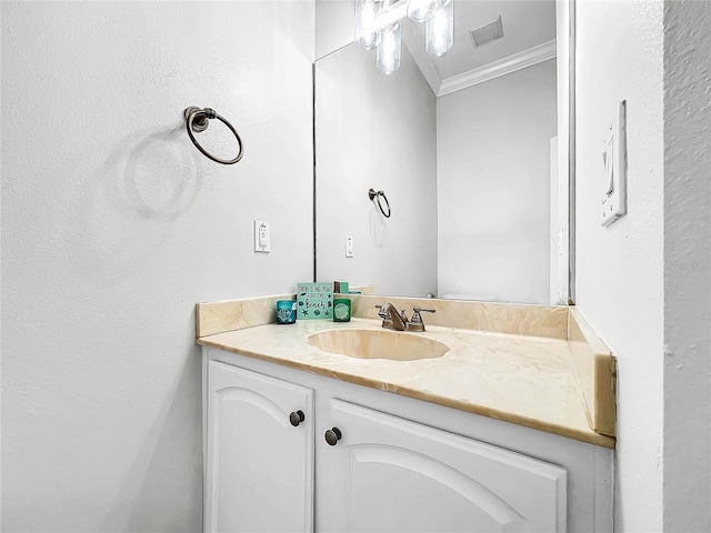 bathroom featuring vanity and ornamental molding