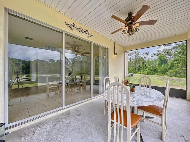 sunroom / solarium with ceiling fan