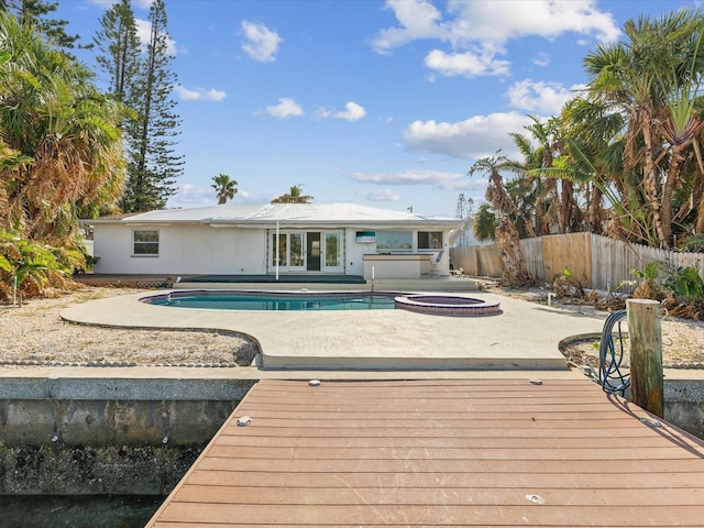 view of pool featuring a jacuzzi and a patio area