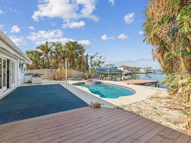 view of pool featuring a water view, a dock, and a patio area