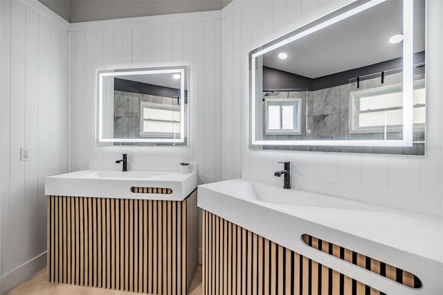 bathroom featuring vanity and wooden walls