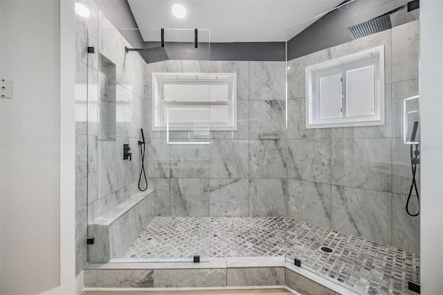 bathroom featuring tiled shower