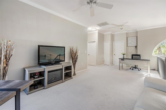 living room featuring ceiling fan, crown molding, and light colored carpet