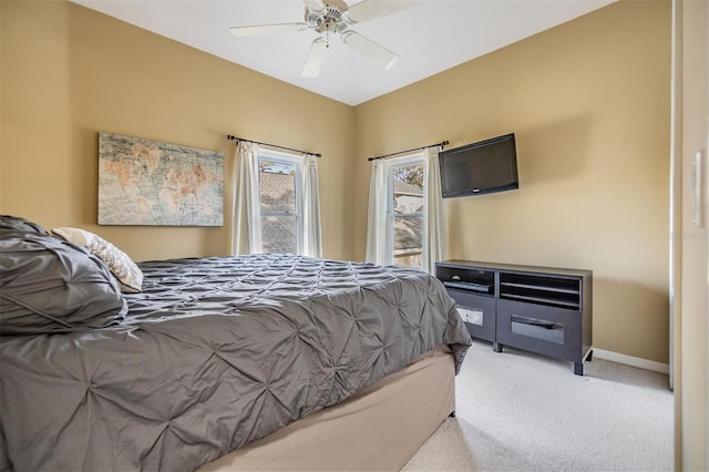 bedroom with ceiling fan and light carpet