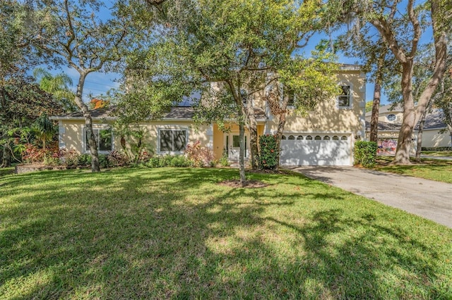 view of front facade featuring a garage and a front lawn