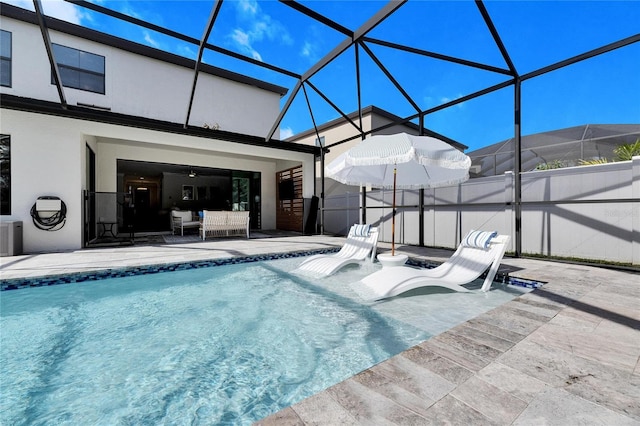 view of pool featuring a lanai and a patio