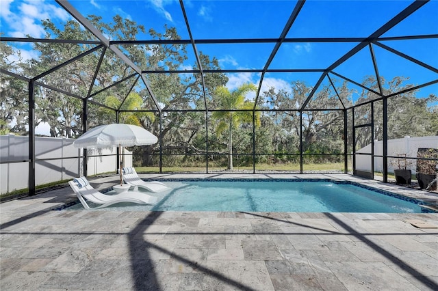 view of pool featuring a patio and a lanai