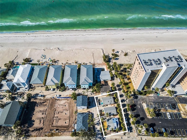 aerial view featuring a water view and a beach view