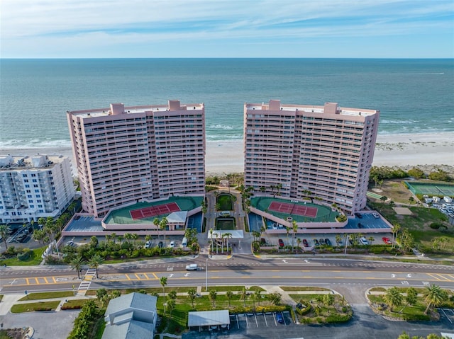 birds eye view of property featuring a water view and a view of the beach