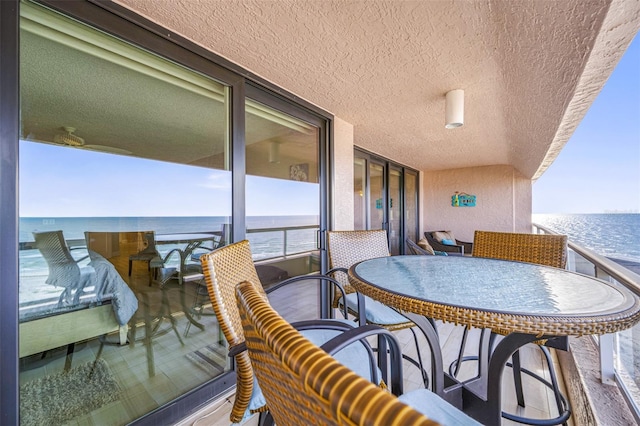 balcony featuring a water view