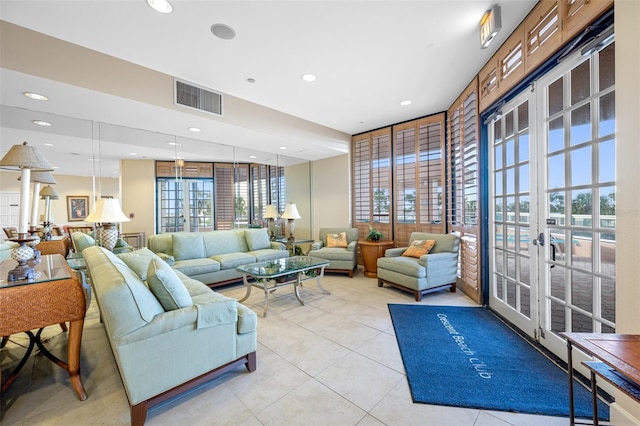 tiled living room featuring french doors and plenty of natural light