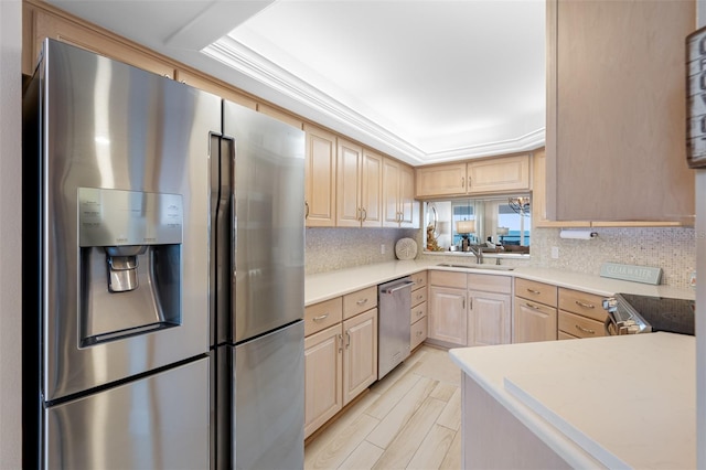 kitchen with backsplash, light brown cabinets, sink, and stainless steel appliances