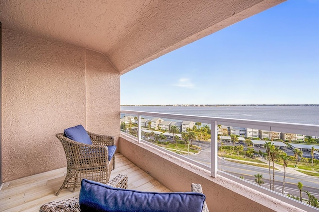 balcony featuring a water view