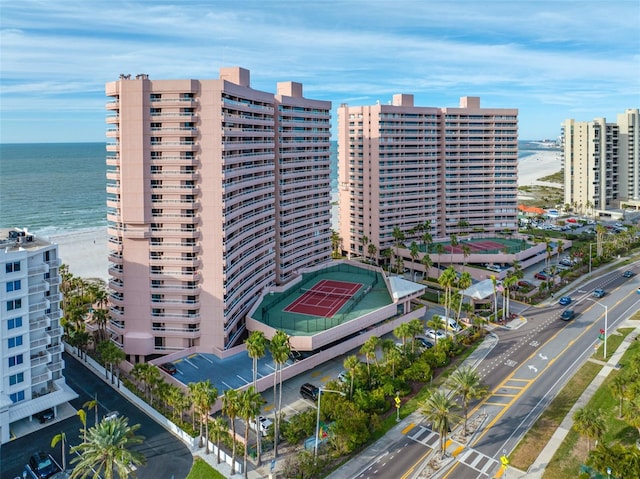 view of property featuring a water view and a view of the beach