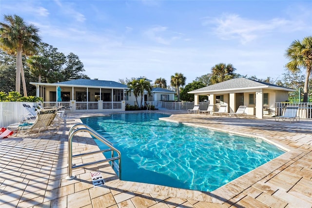 view of swimming pool with a patio