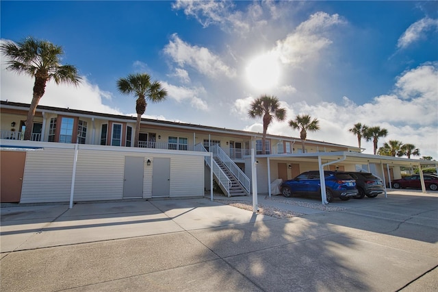 201 Silver Lake Dr Unit 204, Venice, FL 34292 - view of front of house with covered parking and stairway