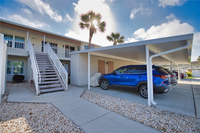 201 Silver Lake Dr Unit 204, Venice, FL 34292 - exterior space with a carport and stairs