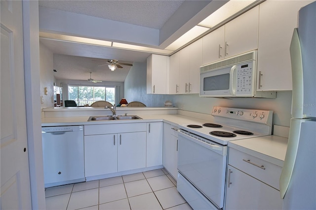 201 Silver Lake Dr Unit 204, Venice, FL 34292 - kitchen featuring ceiling fan, a sink, light countertops, white appliances, and white cabinetry