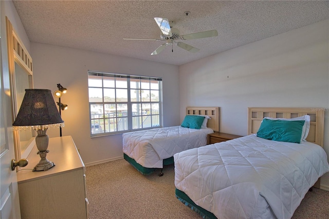 201 Silver Lake Dr Unit 204, Venice, FL 34292 - carpeted bedroom with a ceiling fan, a textured ceiling, and baseboards