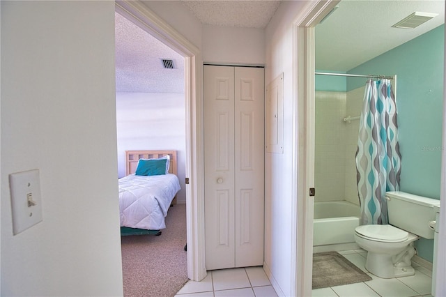 201 Silver Lake Dr Unit 204, Venice, FL 34292 - full bathroom featuring toilet, tile patterned floors, visible vents, and shower / tub combo